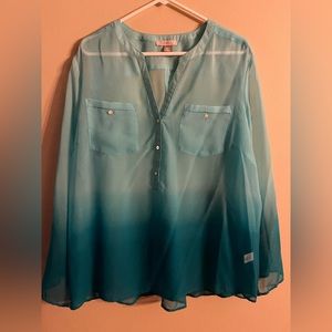 Woman’s teal green blouse